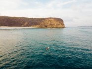Aerial view of surfer in Indian Ocean near Lombok island — Stock Photo