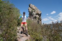 Man running on a trail descending from Pea del Aire — Stock Photo