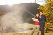 Couple orientating with at map in North Wales — Stock Photo