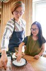 Mother and daughter making the salted egg together — Stock Photo