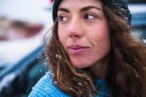 Woman surfer portrait with snow in hair — Stock Photo
