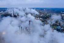 Aerial shot over refinery during dusk — Stock Photo