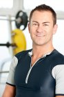 Mid adult man looking at camera in gym — Stock Photo