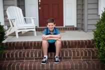 Smiling Tween Boy With Braces Sits on Brick Front Steps — Stock Photo