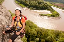 Woman rappelling of cliff in south Wales — Stock Photo