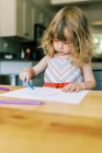 Stock portrait of a little toddler girl drawing — Stock Photo