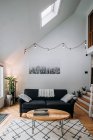 Scandinavian living room interior with couch coffee table and carpet — Stock Photo