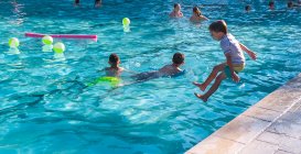 Children playing in a swimming pool. — Stock Photo