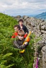 Three teenage boys playing outside with their toy guns — Stock Photo