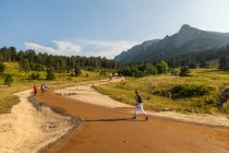 People hike on regraded trail in Chautauqua Park in Boulder, Colorado — Stock Photo
