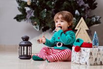 A12 month old baby dressed as elf  at home — Stock Photo