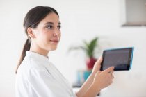 Young female doctor in a practice — Stock Photo