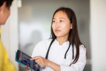 Young asia doctor female woman and patientwith report in a practice — Stock Photo