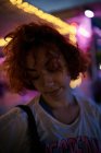 Young alternative redhead girl portrait in a purple light — Stock Photo