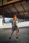 Young alternative redhead girl roller skater — Stock Photo