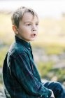 Little boy looking at something very seriously — Stock Photo