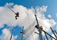 Girl on a high swing at high rope access course in Iceland — Stock Photo