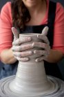 Young woman working on ceramics — Stock Photo