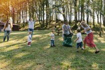 Group of volunteer families a forest. Environmental protection concept — Stock Photo