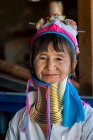 Senior Burmese woman from Kayan tribe (AKA Padaung, long-neck) smiling at camera, near Loikaw, Myanmar — Stock Photo