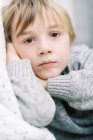 Portrait of a little blonde boy with a neutral expression — Stock Photo
