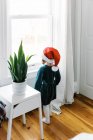 Little girl looking out window waiting for Santa clause on Christmas — Stock Photo
