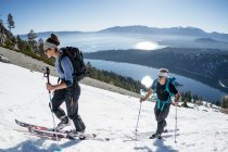 Teenage woman and mid forties man hiking Washington Pass — Stock Photo