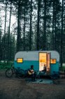 A couple camps in a trailer in Mt. Hood National Forest, OR. — Stock Photo