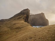 Huge cliffsides near Drangarnir sea stack in the Faroe Islands — Stock Photo