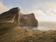 Huge cliffsides near Drangarnir sea stack in the Faroe Islands — Stock Photo