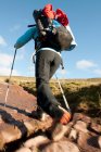 Female hiker walking up towards Pen Y Fan in Wales — Stock Photo