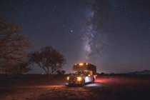 A beautiful sunset in the night sky with milky way, stars and trees — Stock Photo