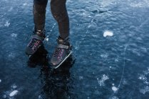 Cute boy on froze lake  skating — Stock Photo