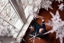 Little child with christmas decorations in the room — Stock Photo