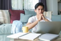 Young man working and learning online at home. Young man video call conference online with his colleagues. — Stock Photo