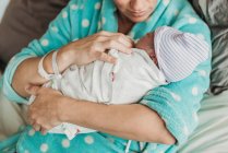 Close up image of fathers hands holding newborn son right after birth — Stock Photo