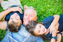 TWINS GOOFING AROUND WITH DAD — Stock Photo