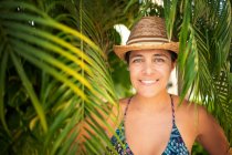 Relaxed happy woman in the pool in tropical climate. Portrait — Stock Photo