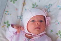 Adorable white newborn baby girl — Stock Photo