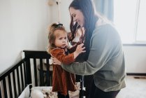 Beautiful young mother and her daughter — Stock Photo