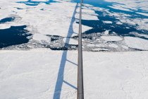 Aerial over Long Bridge and Ice Filled Bay in Canada — Foto stock
