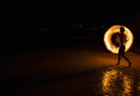 Fire dancer performing on the beach in Railay — Stock Photo