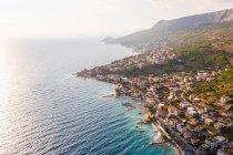 Aerial view of Dugi Rat costal city during a scenic sunset, Croatia. — Stock Photo