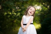 Cute little girl toddler laughing outdoors. — Stock Photo