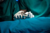 Close up hand surgeon with scalpel in the operating room at hospital. — Stock Photo