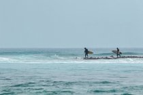 Surfers in Indian Ocean, Maldives — Stock Photo