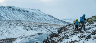 People hiking through the frozen landscape in the west of Iceland — Stock Photo