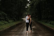 A couple in love kissing in the rain. — Stock Photo