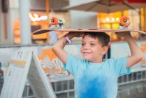 Young boy with a skateboard — Stock Photo