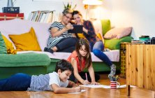 Lesbian couple with their children having fun at home — Stock Photo